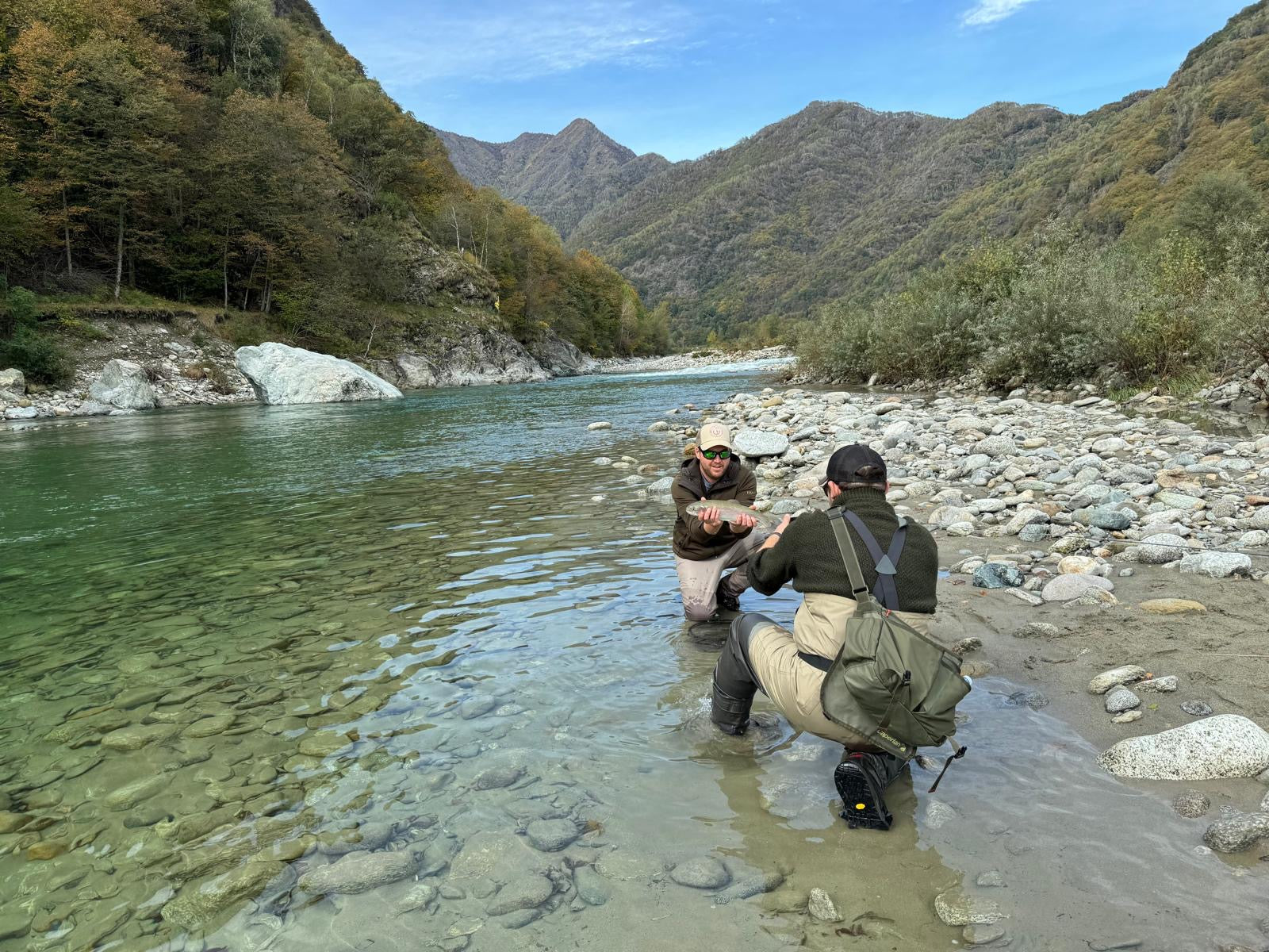 a customer catchig aRainbow trout on the sesia river