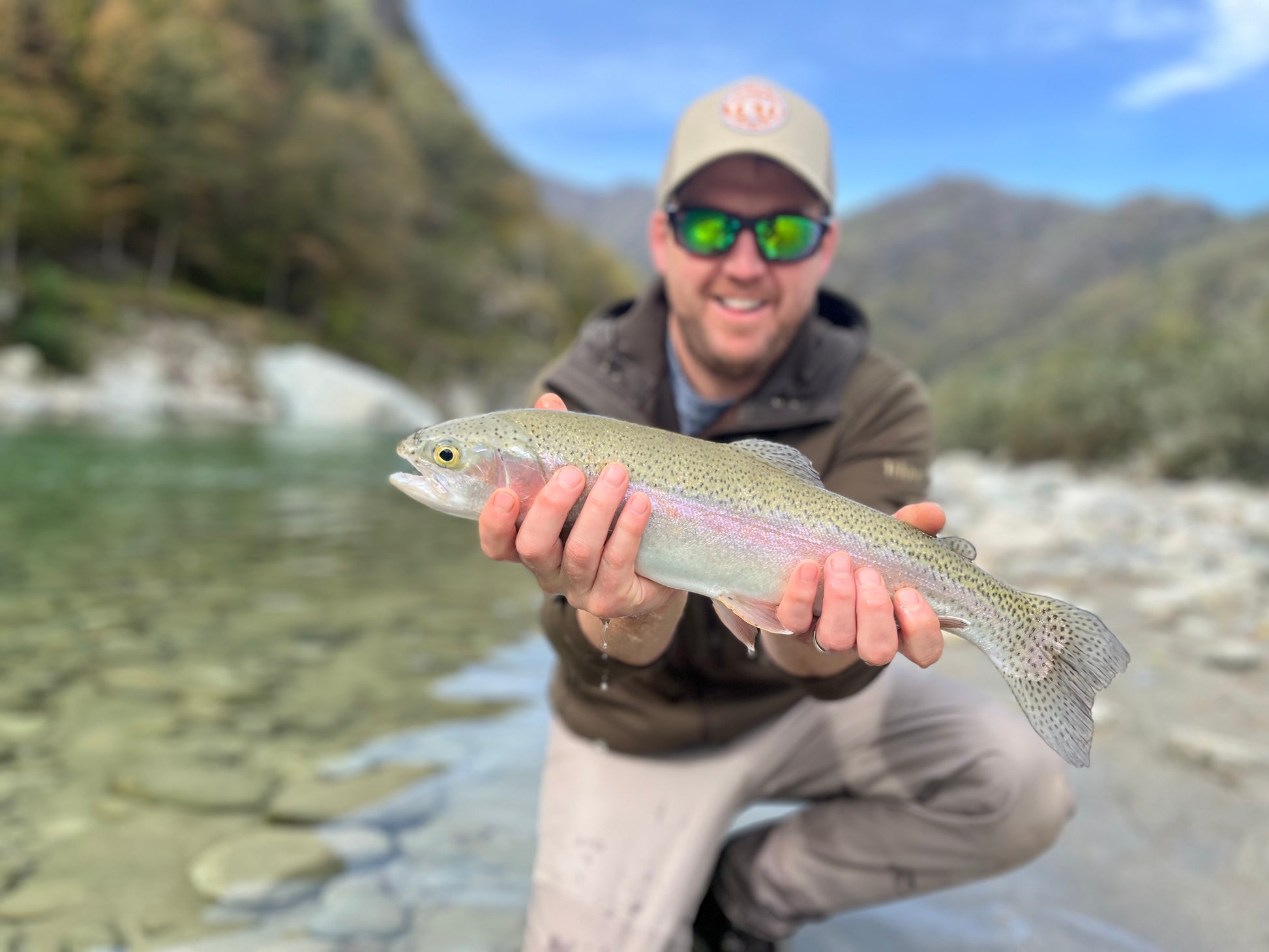 catch and release with photo moment of rainbow trout